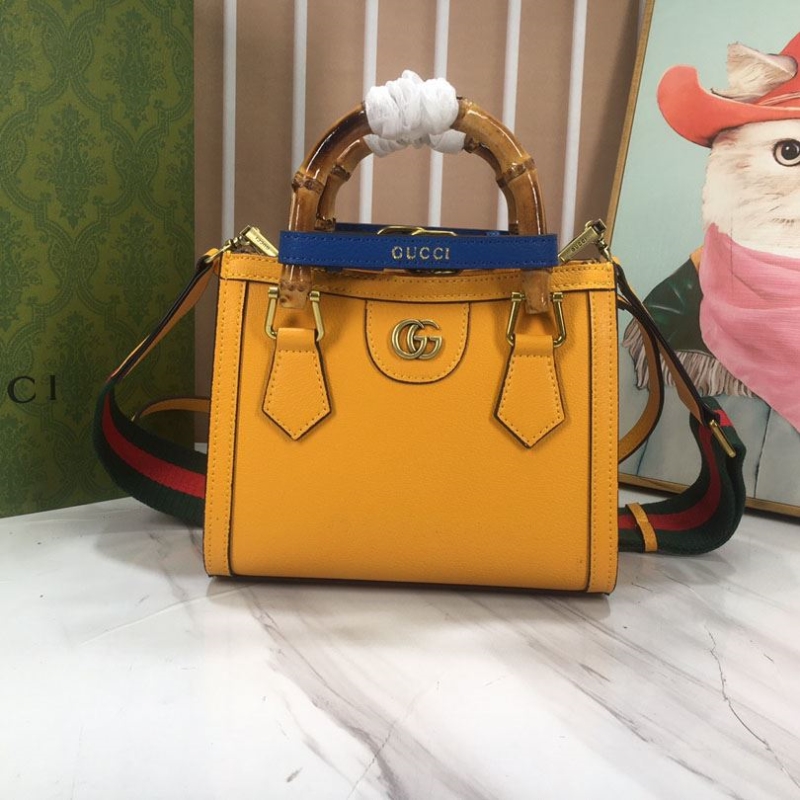 G*u*i top handle bags